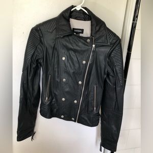 Black danier leather moto jacket, lined with beautiful floral, fits like an XS